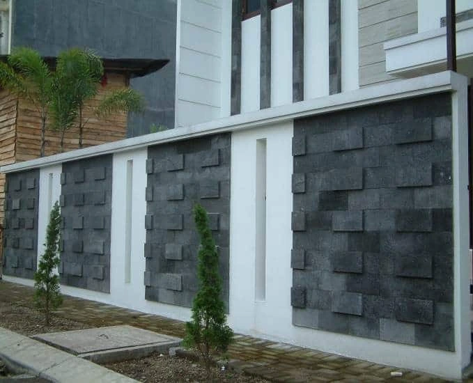 Dinding pagar rumah modern menggunakan batu alam candi susun acak warna hitam abu untuk eksterior