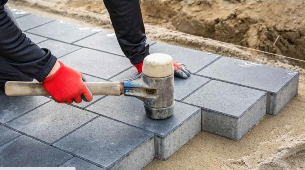 proses pemasangan paving block k300 dengan pemadatan manual
